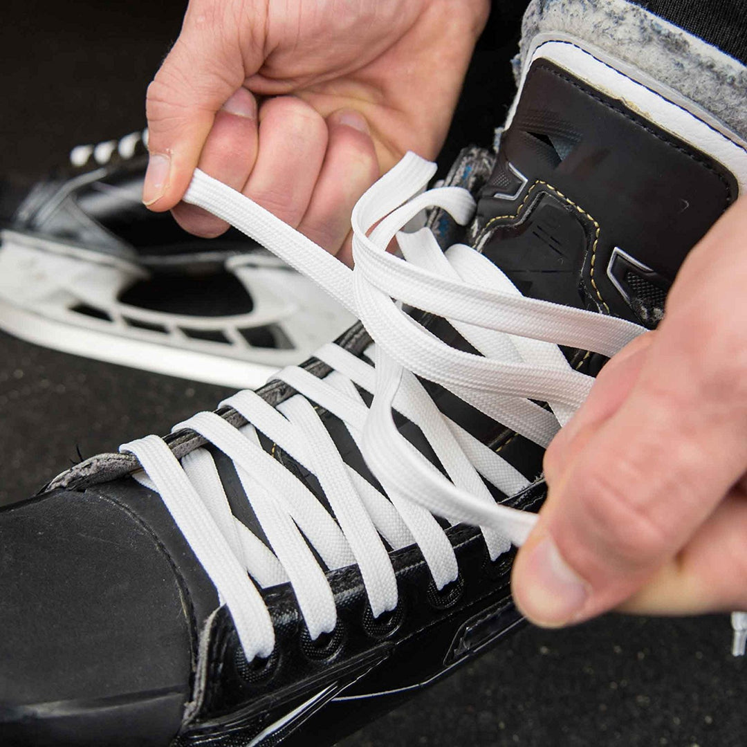 White waxed Hockey referee laces close shot on skate
