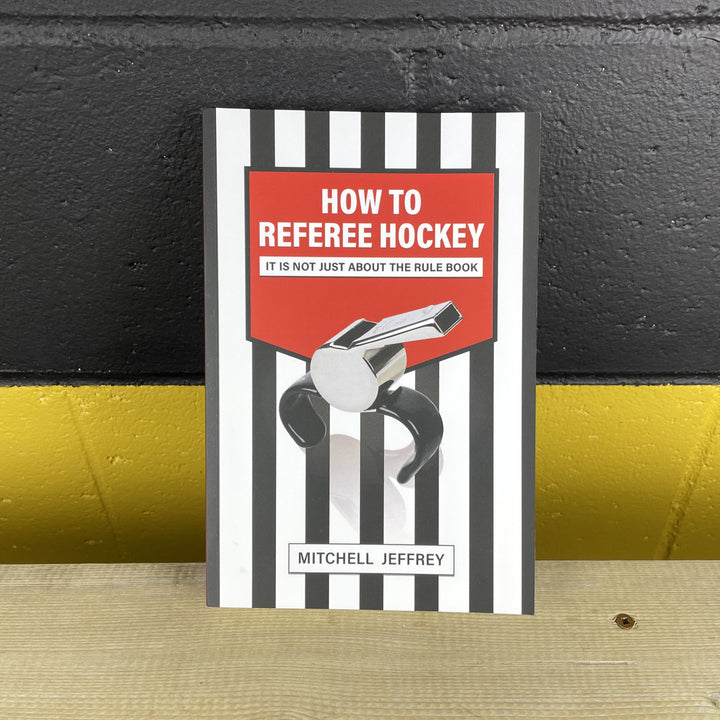 the book - How to referee hockey by Mitchell Jeffrey, front page